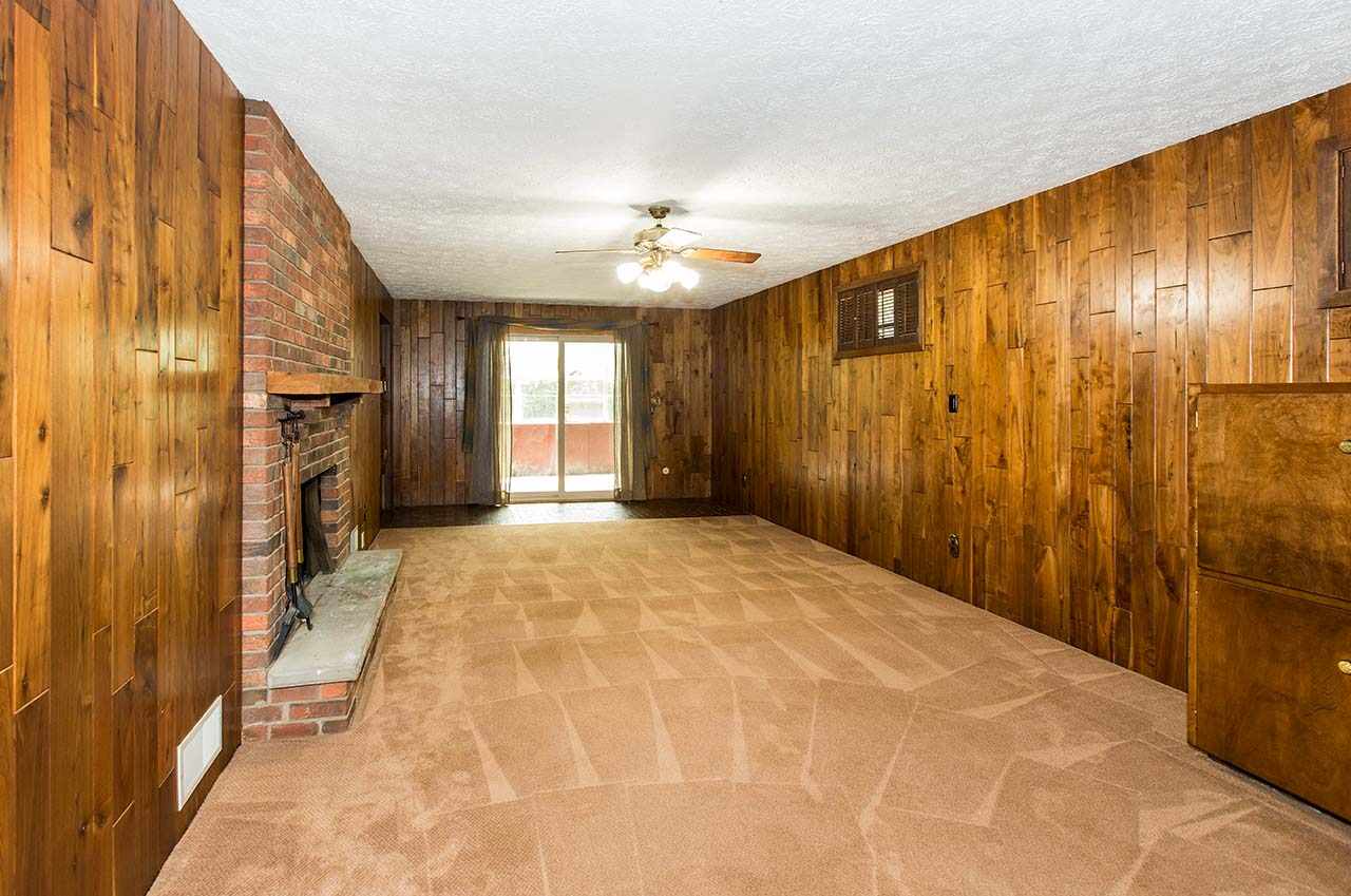 5221 Brookview Road Rockford, IL 61107 - Photo 18 of 25 a view of an empty room with a fireplace