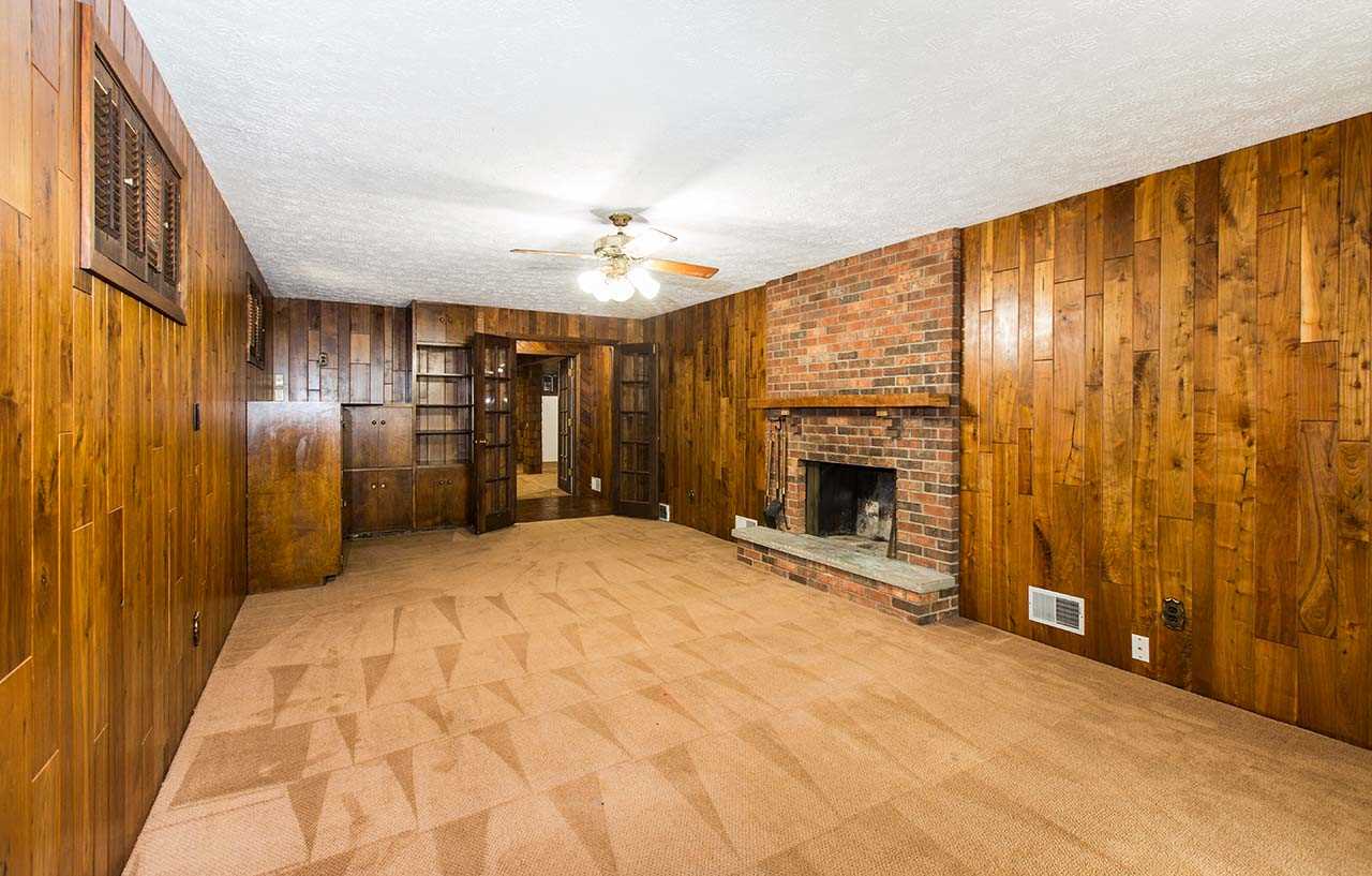 5221 Brookview Road Rockford, IL 61107 - Photo 19 of 25 a view of an empty room with a fireplace