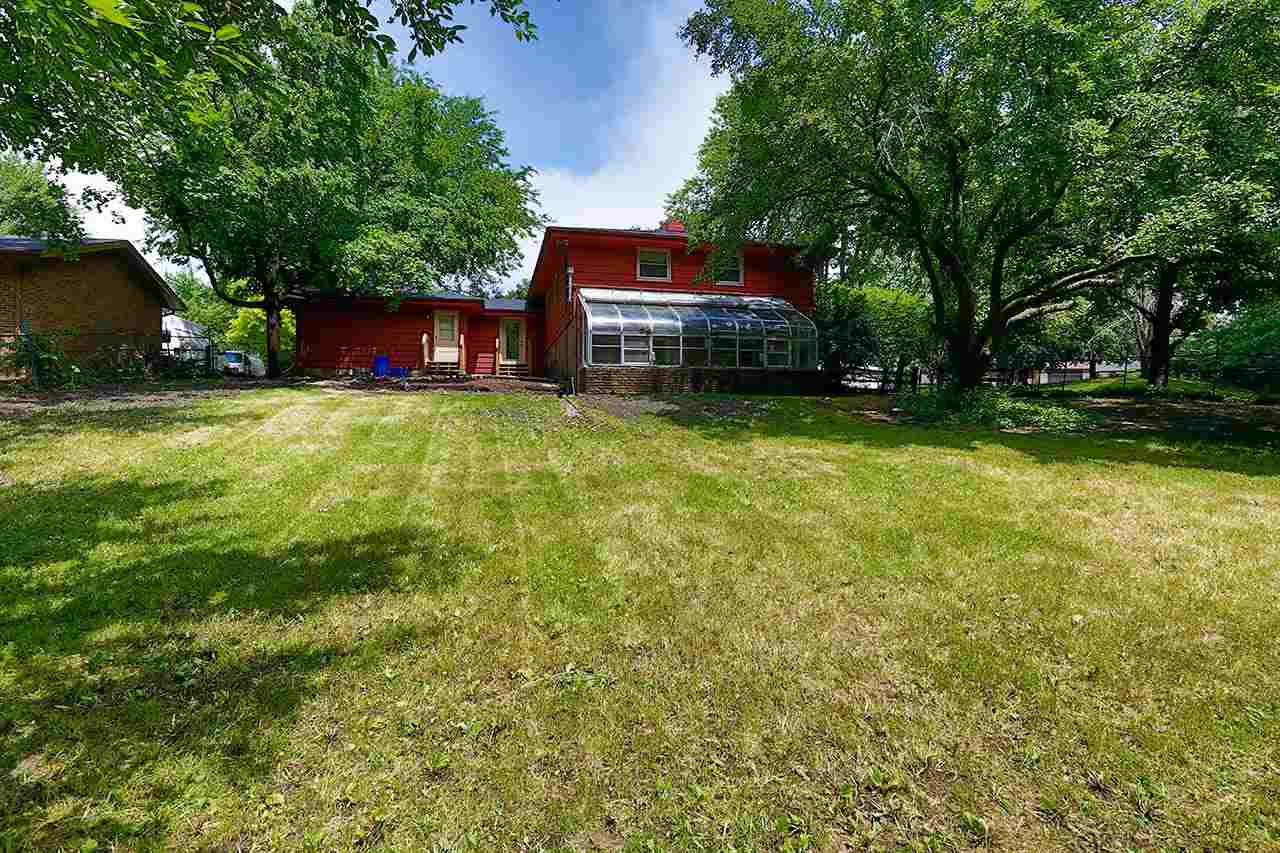 5221 Brookview Road Rockford, IL 61107 - Photo 23 of 25 a view of a big yard with plants and large trees