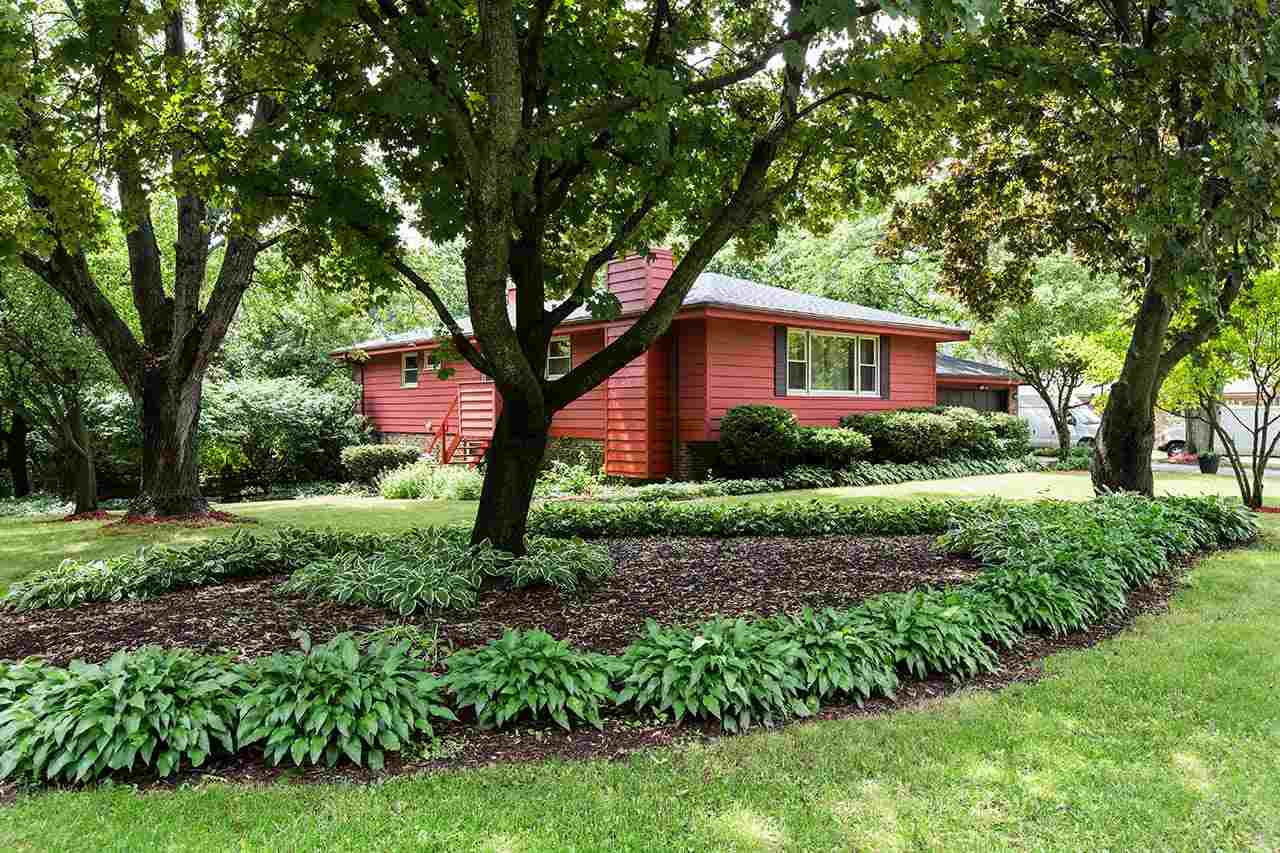 5221 Brookview Road Rockford, IL 61107 - Photo 24 of 25 a front view of a house with garden