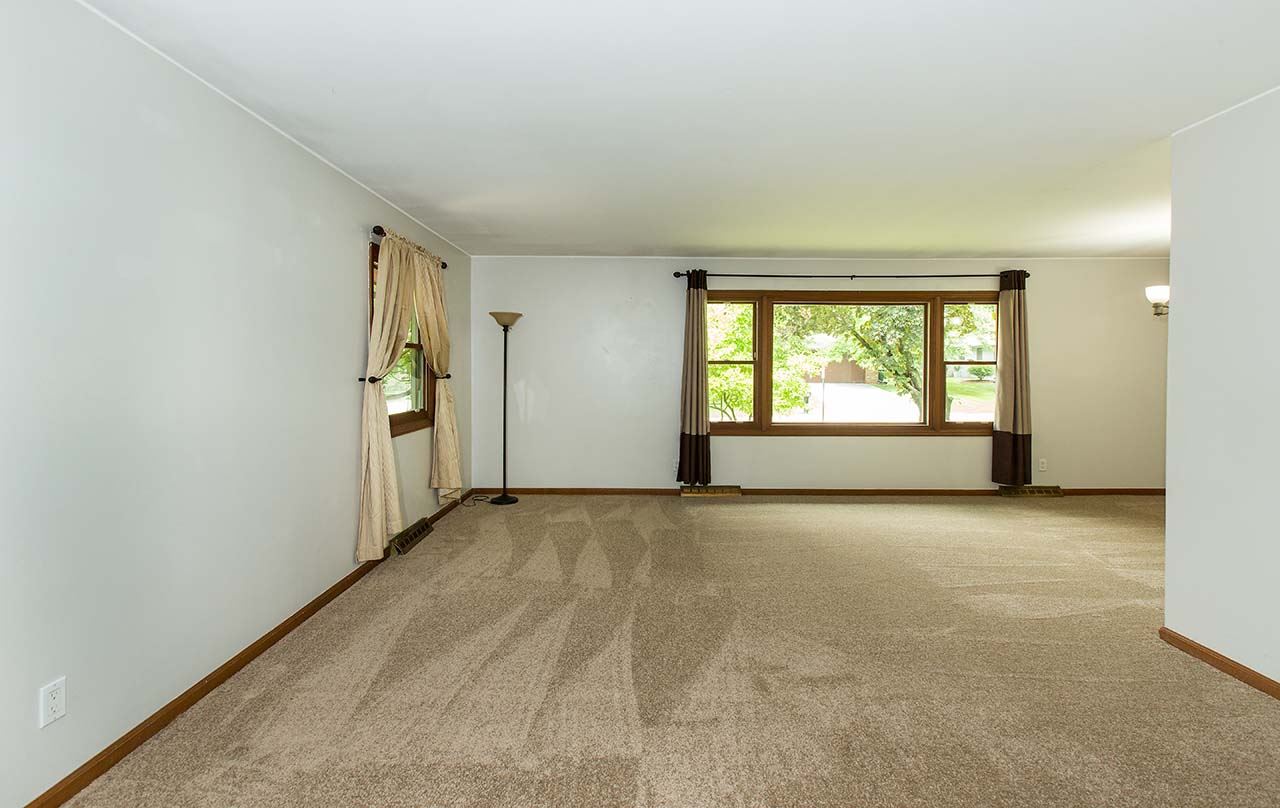 5221 Brookview Road Rockford, IL 61107 - Photo 4 of 25 an empty room with windows