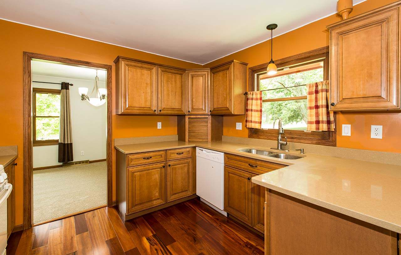5221 Brookview Road Rockford, IL 61107 - Photo 9 of 25 a kitchen with a sink a window and cabinets