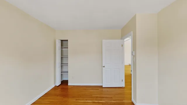 a view of room with wooden floor