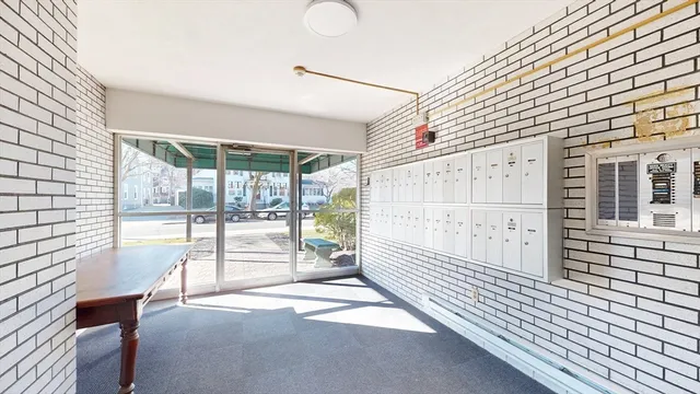 a view of a porch with wooden floor and iron stairs