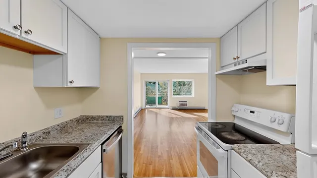 a kitchen that has a sink and a stove
