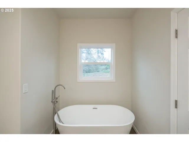 a view of an empty room and a windows