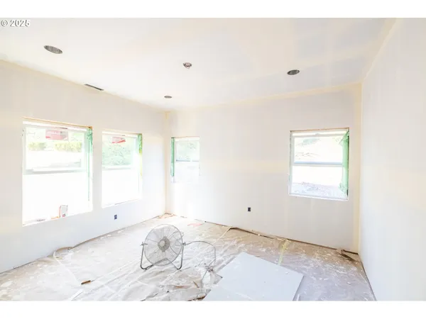 a view of a room that has a window in it