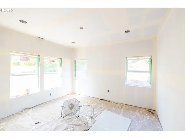 a view of a room that has a window in it