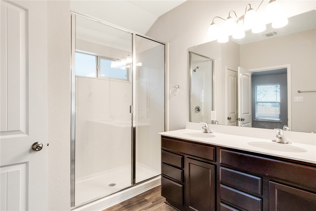 117 Nathaniel Drive Taylor, TX 76574 - Photo 11 of 26 a bathroom with a sink double vanity and a mirror