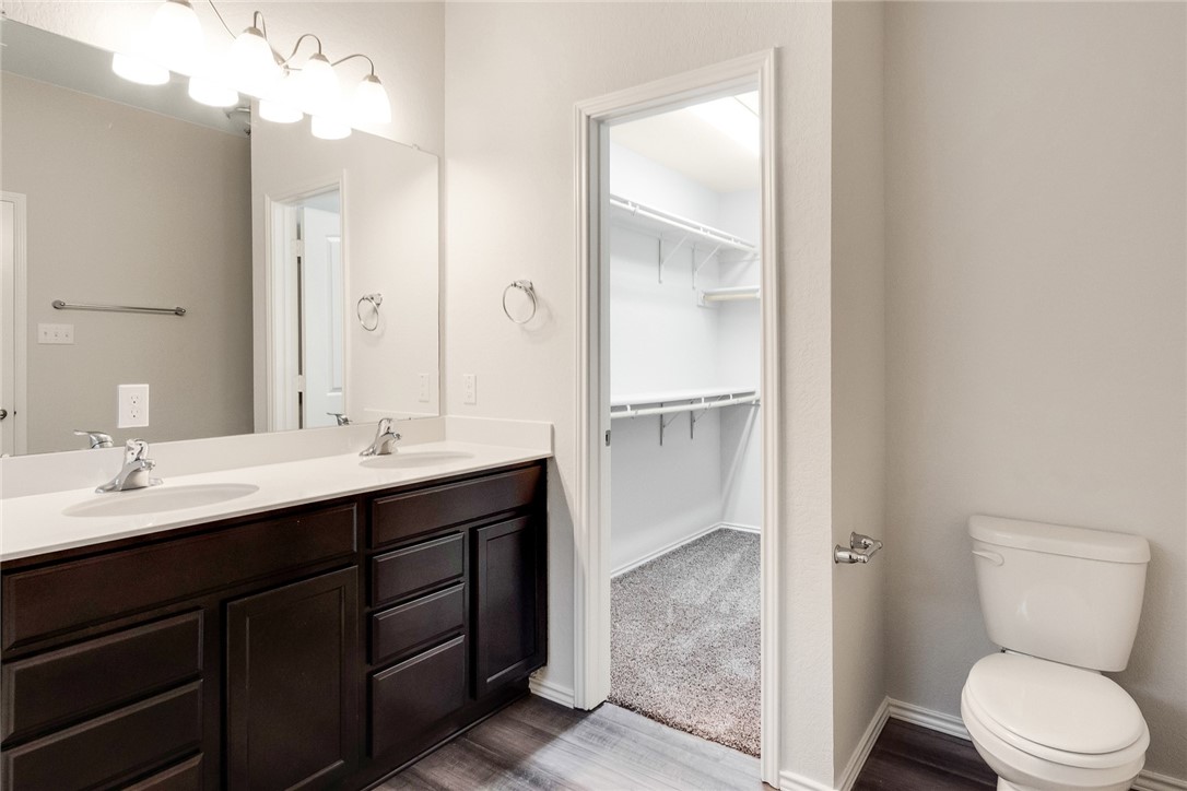 117 Nathaniel Drive Taylor, TX 76574 - Photo 12 of 26 a bathroom with a sink a toilet and shower
