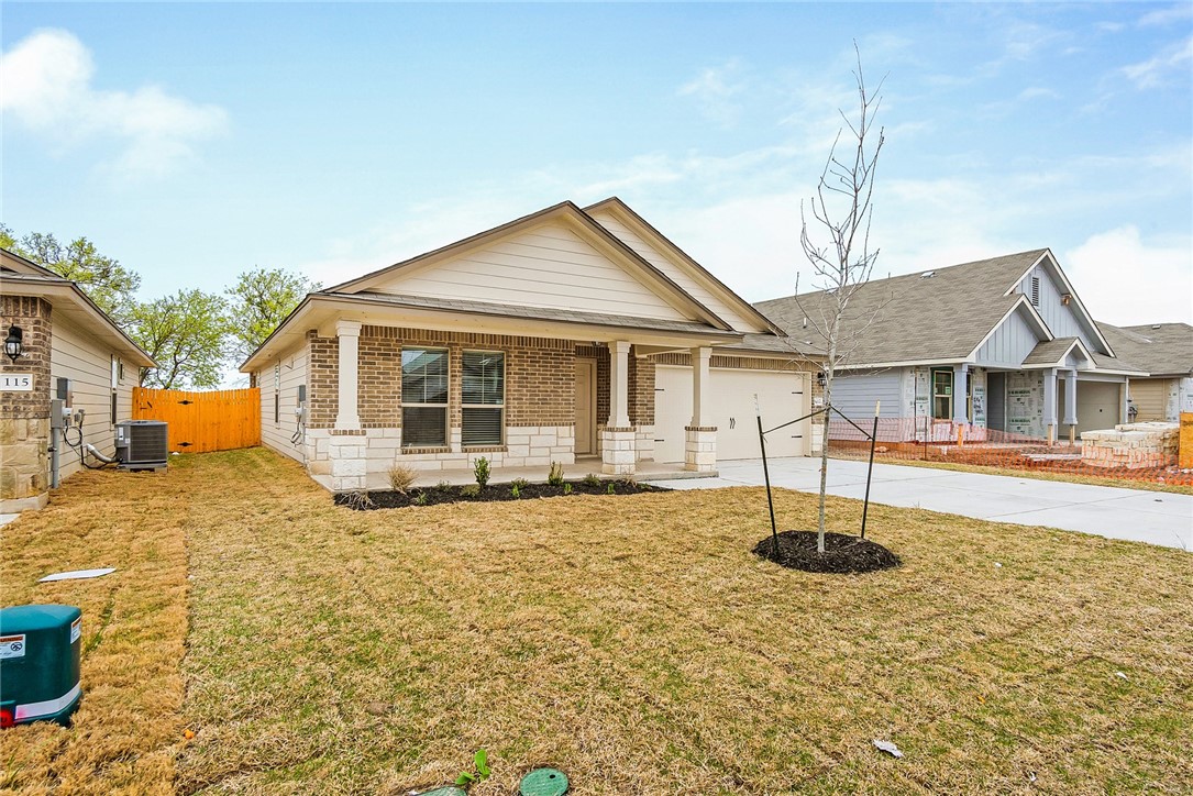 117 Nathaniel Drive Taylor, TX 76574 - Photo 4 of 26 a front view of a house with a yard