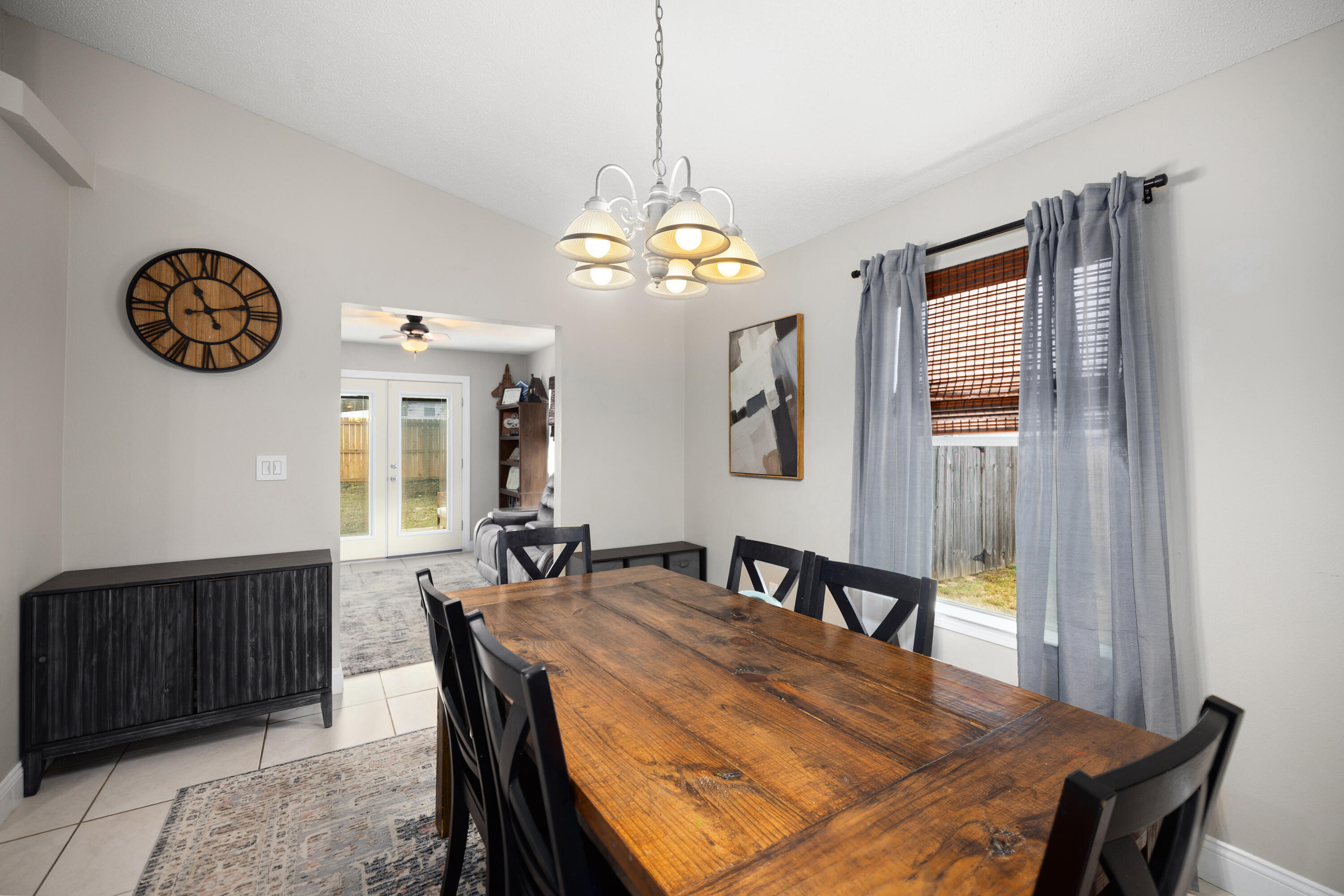 202 Limestone Circle Crestview, FL 32539 - Photo 18 of 49 a view of a dining room with furniture window and wooden floor