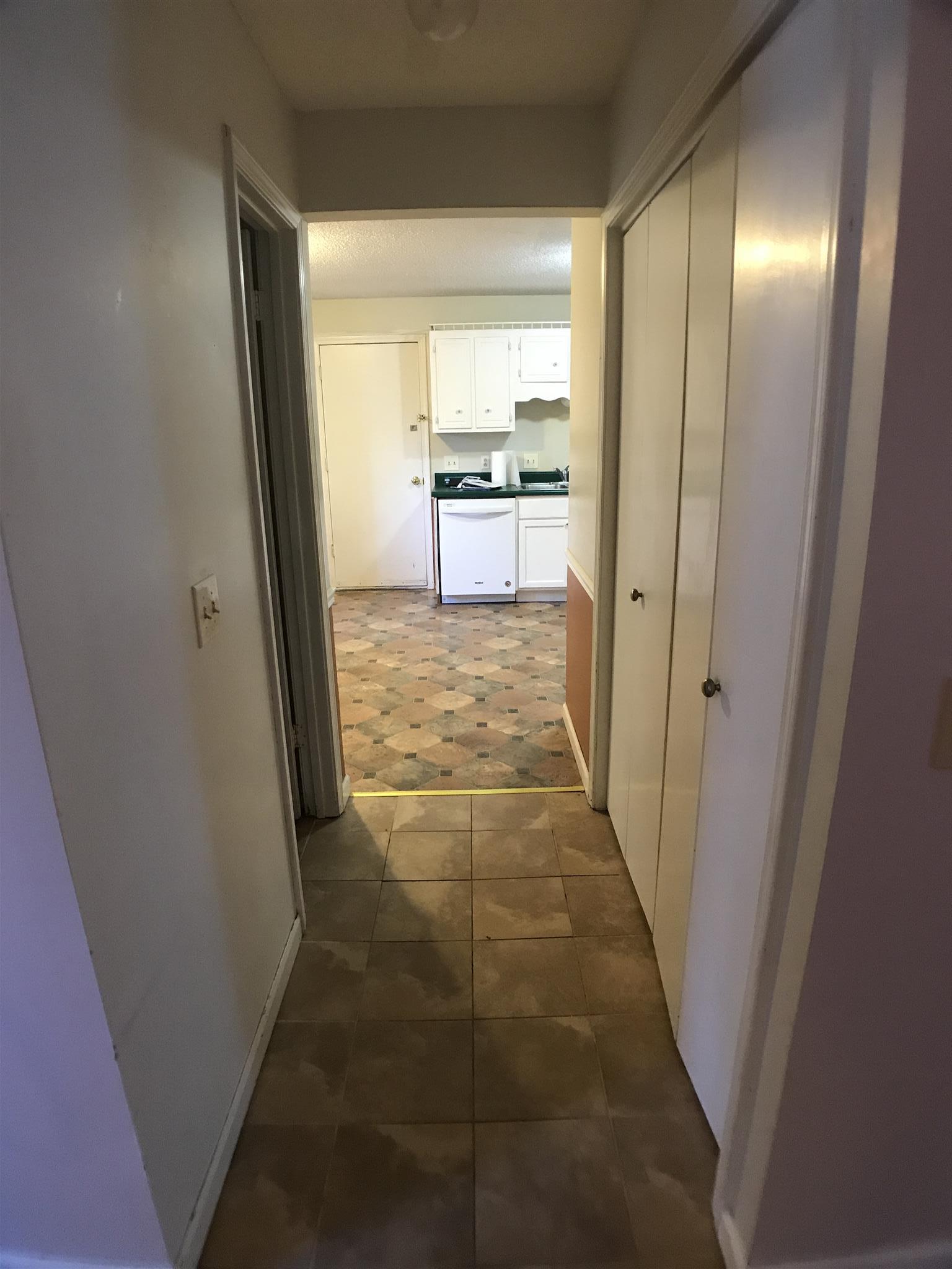 3404 Towneship Road Antioch, TN 37013 - Photo 14 of 28 Hallway connecting kitchen and living room. Half bath in the hallway.
