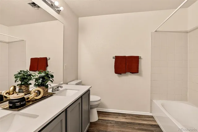 a view of a lake with houses in the back