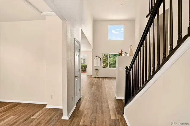 a view of a room with window and wooden floor