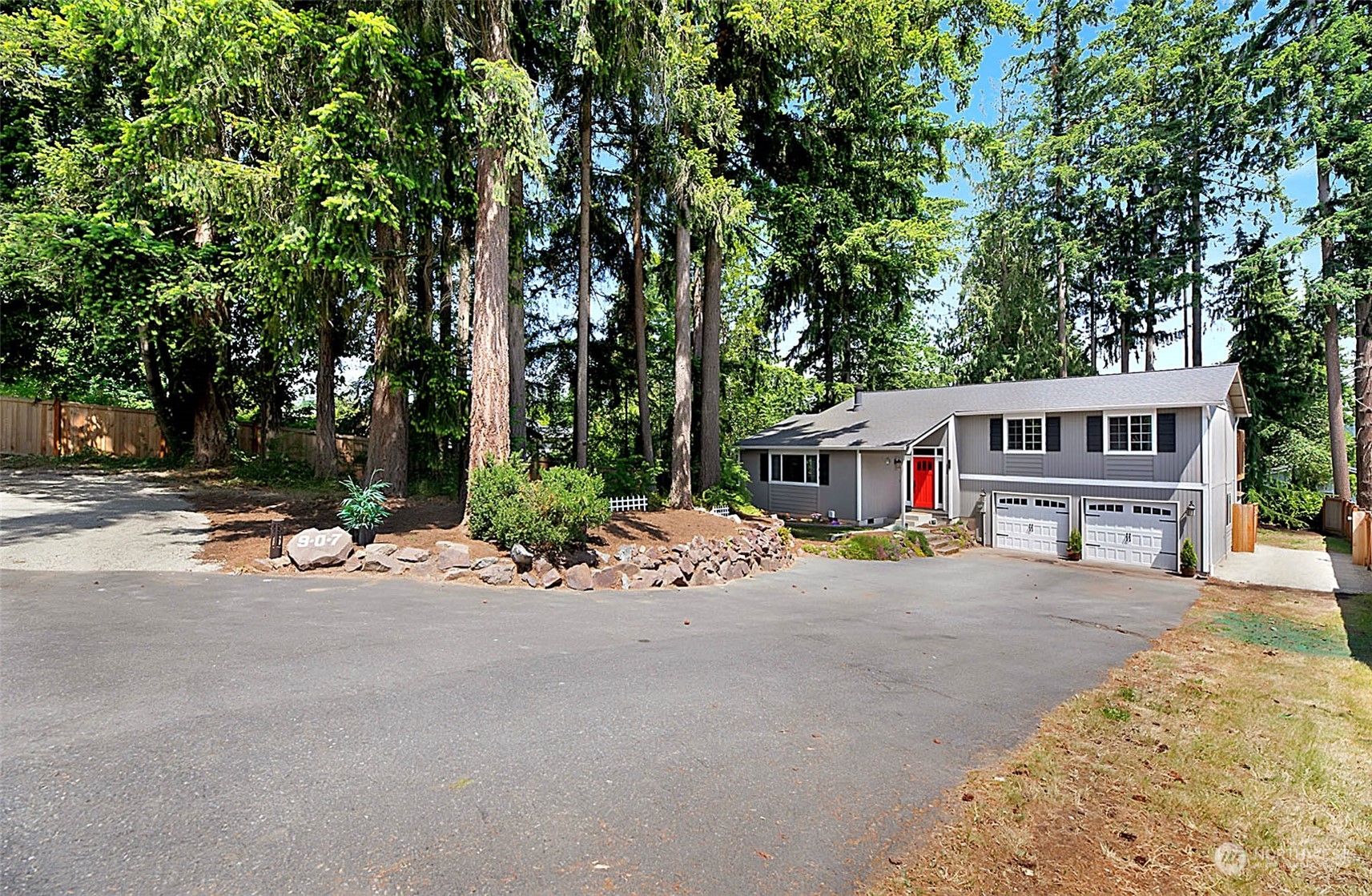 907 Harvest Road Bothell, WA 98012 - Photo 1 of 28 front view of a house with a tree in front of it