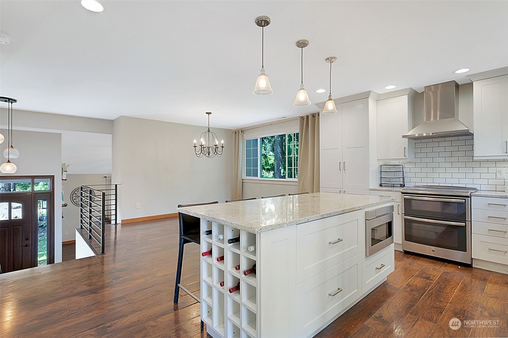 907 Harvest Road Bothell, WA 98012 - Photo 11 of 28 a kitchen with stainless steel appliances granite countertop a stove a sink and a refrigerator
