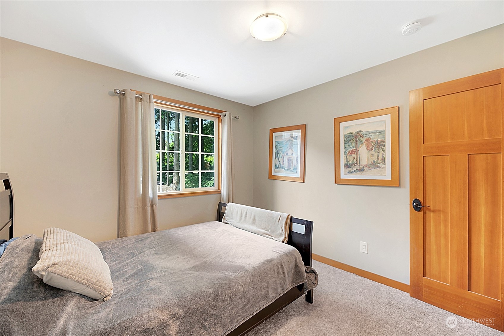 907 Harvest Road Bothell, WA 98012 - Photo 17 of 28 a bedroom with a bed and a window