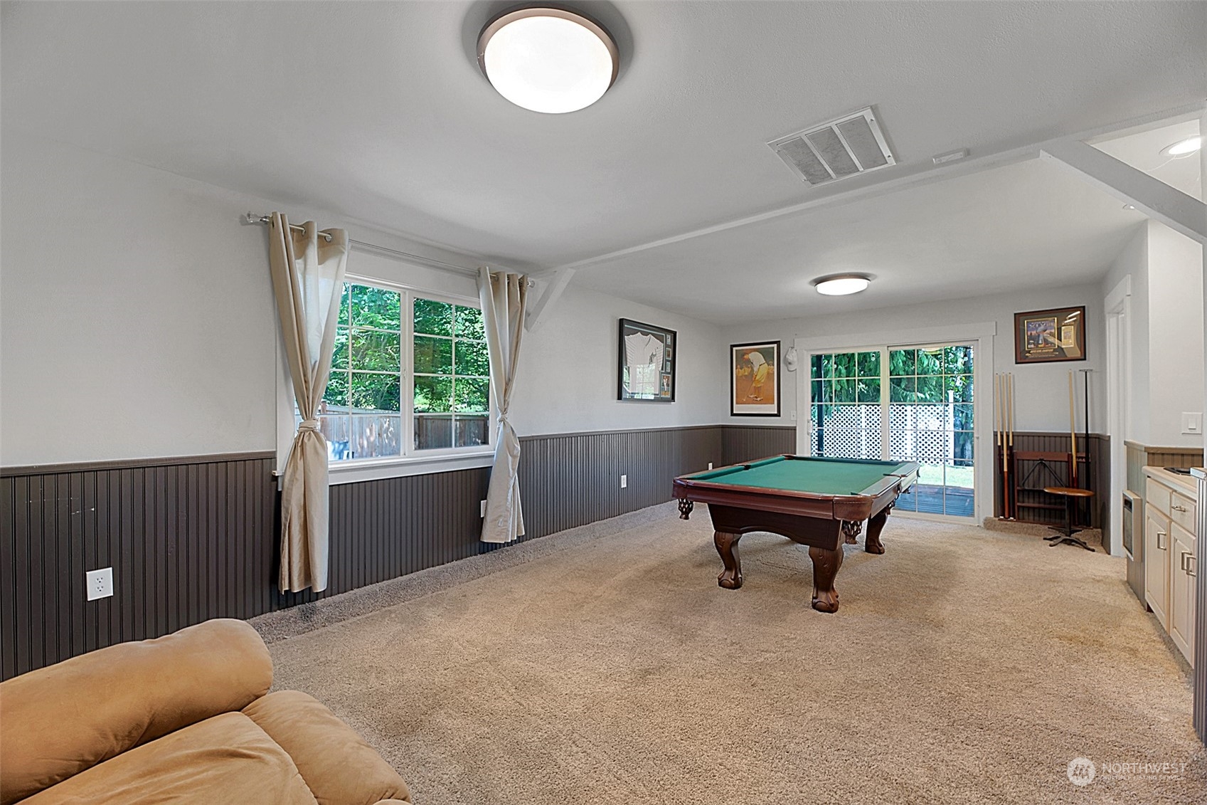 907 Harvest Road Bothell, WA 98012 - Photo 18 of 28 a living room with furniture and a fireplace