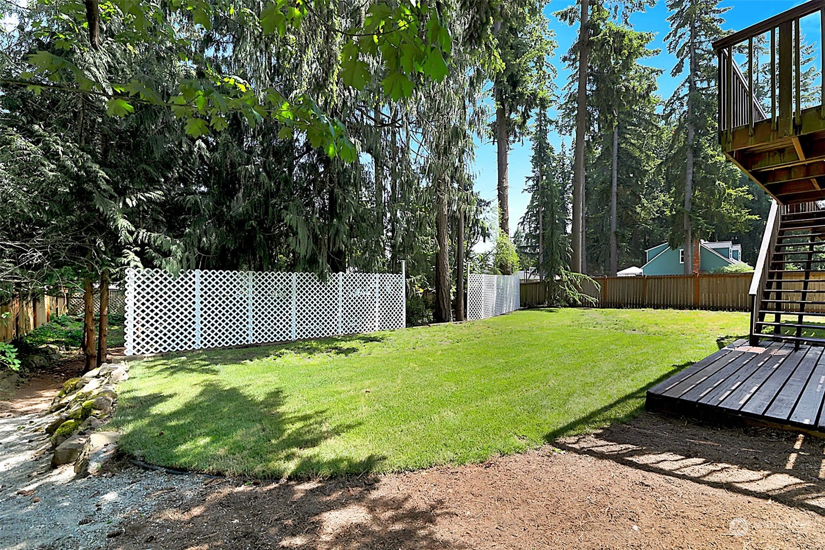 907 Harvest Road Bothell, WA 98012 - Photo 21 of 28 a view of a backyard with a garden