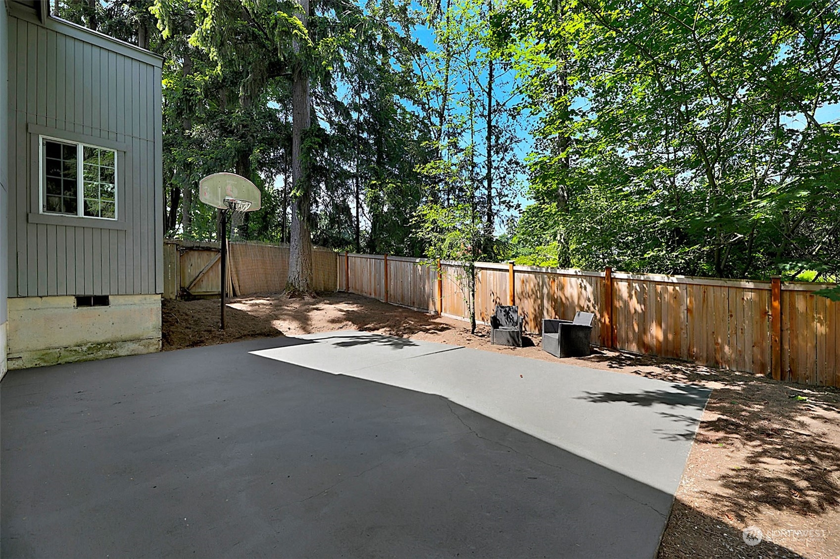 907 Harvest Road Bothell, WA 98012 - Photo 23 of 28 a view of a street with wooden fence and a bench