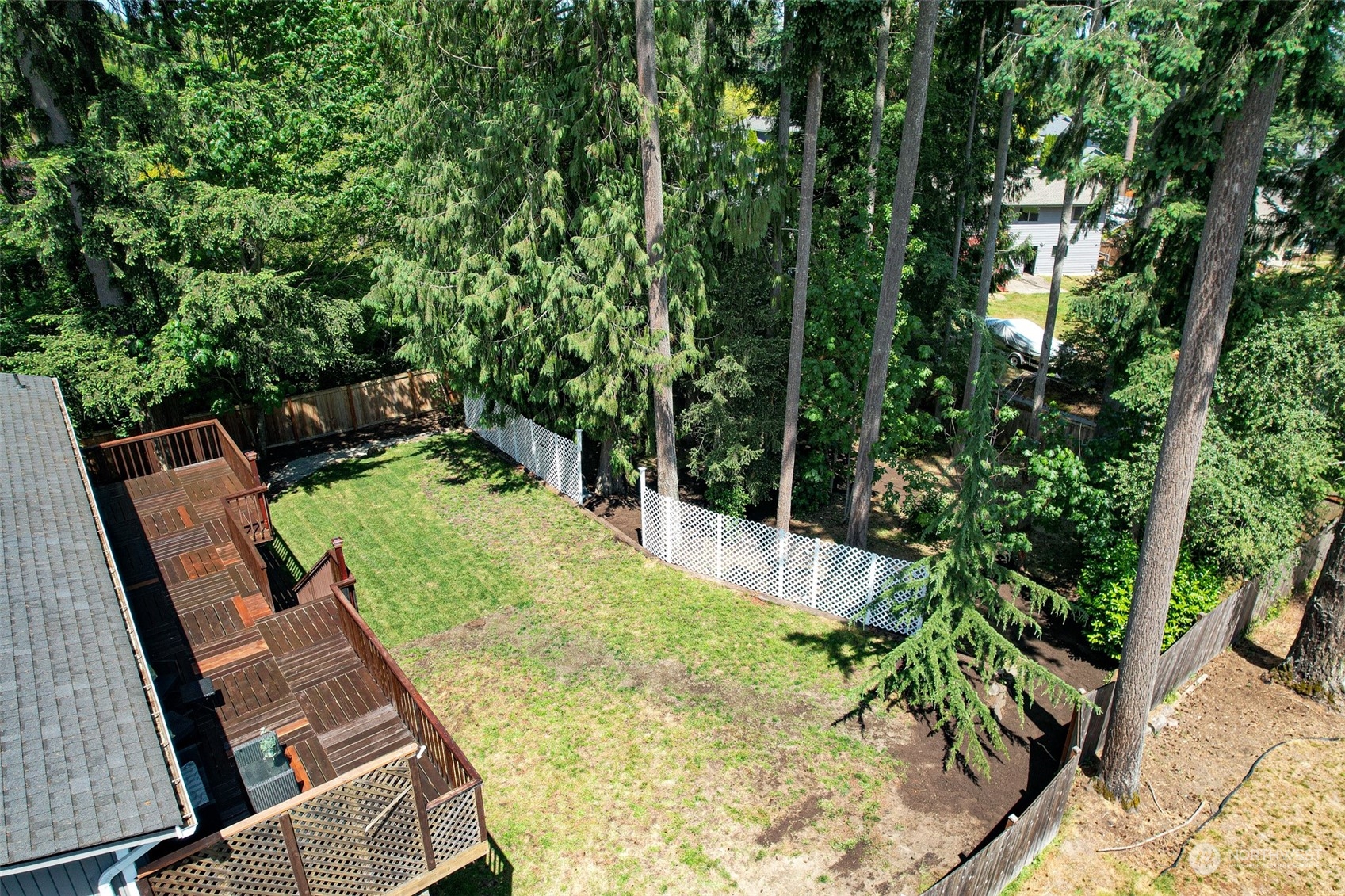 907 Harvest Road Bothell, WA 98012 - Photo 26 of 28 a view of a backyard with sitting area