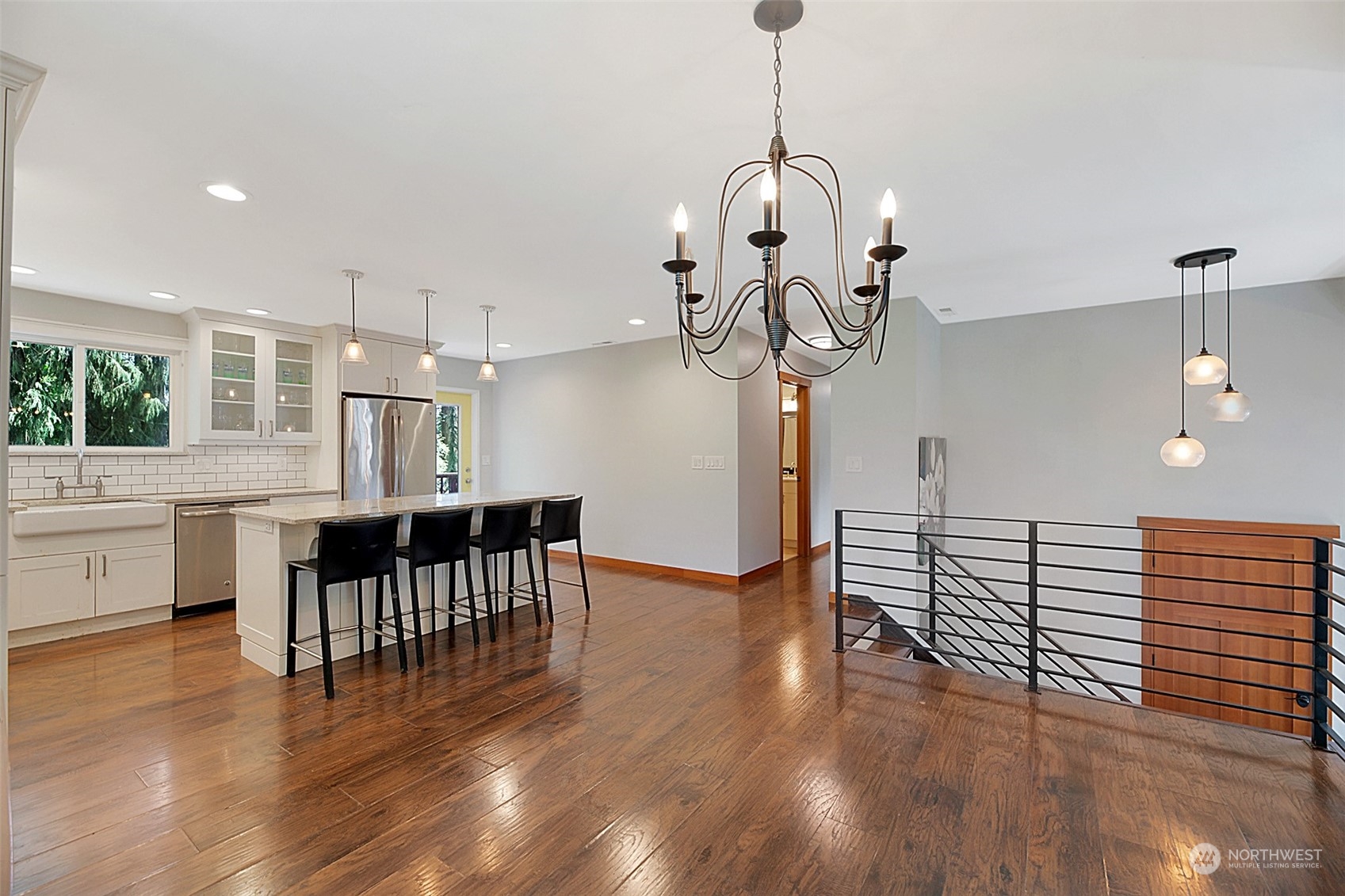907 Harvest Road Bothell, WA 98012 - Photo 7 of 28 a view of dining room and hall with wooden floor