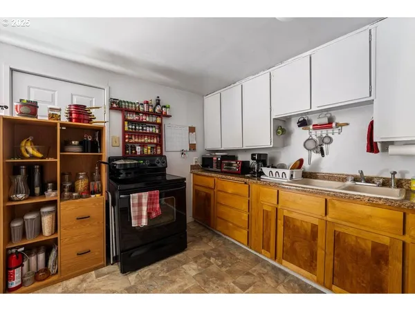 a kitchen with stainless steel appliances granite countertop a stove and cabinets