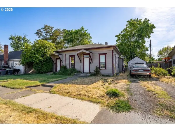 a house view with a garden space