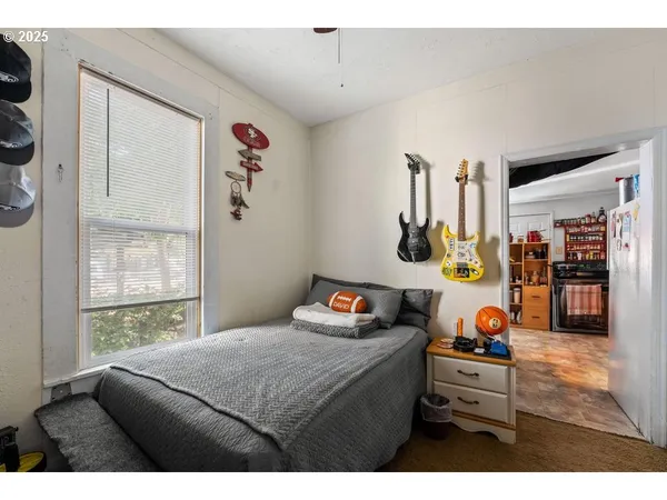 a bedroom with furniture and a window