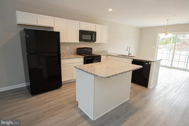an entryway with wooden floor
