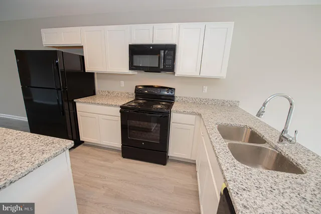 an empty room with wooden floor