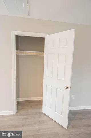a view of a kitchen with microwave and cabinets