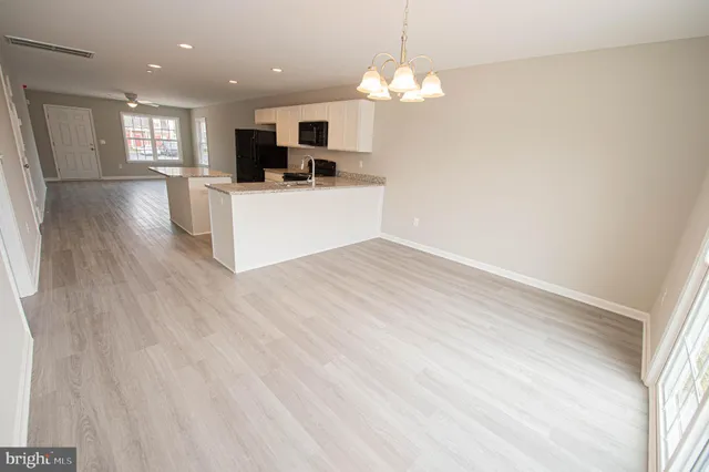 a view of a livingroom with a ceiling fan