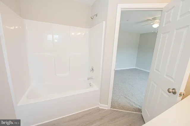 an empty room with a empty space and windows