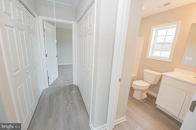 a bathroom with a toilet and a bath tub
