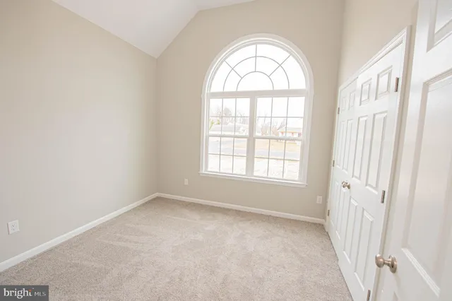 a bathroom with a sink a toilet a mirror and shower