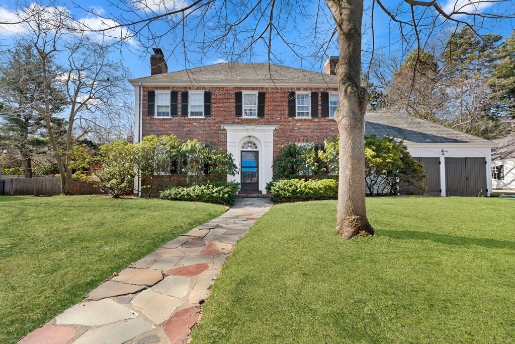 a front view of a house with a yard