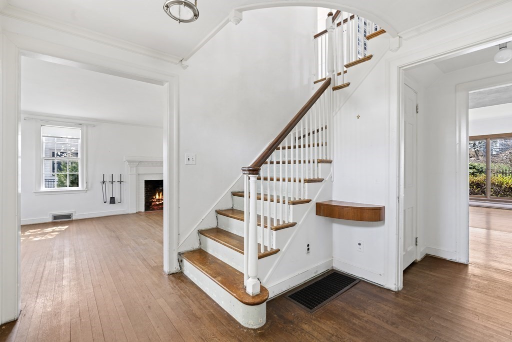 160 Reservoir Road Chestnut Hill, MA 02467 - Photo 11 of 42 a view of entryway with wooden floor and stairs