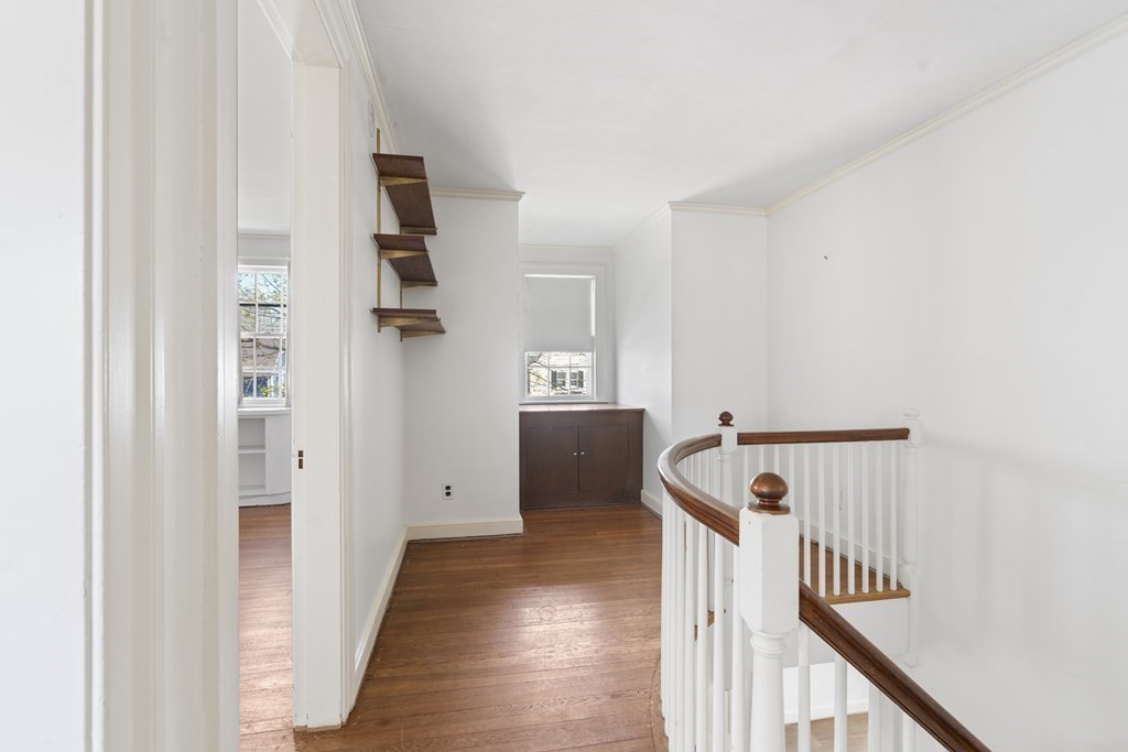 160 Reservoir Road Chestnut Hill, MA 02467 - Photo 16 of 42 a view of a hallway with wooden floor and staircase