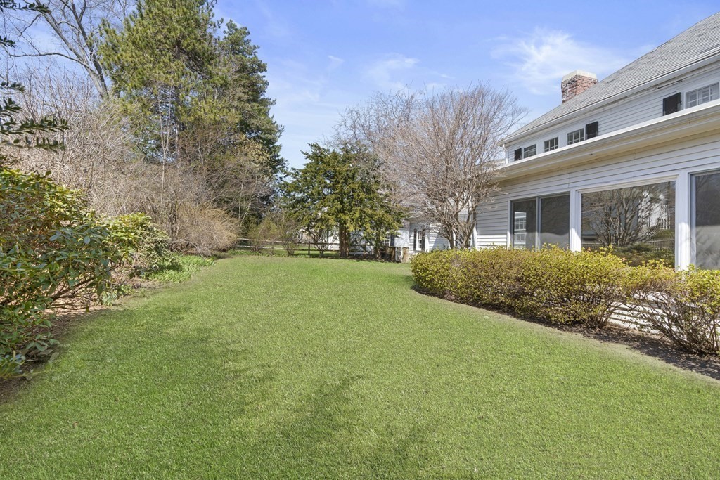 160 Reservoir Road Chestnut Hill, MA 02467 - Photo 26 of 42 a front view of house with yard and green space