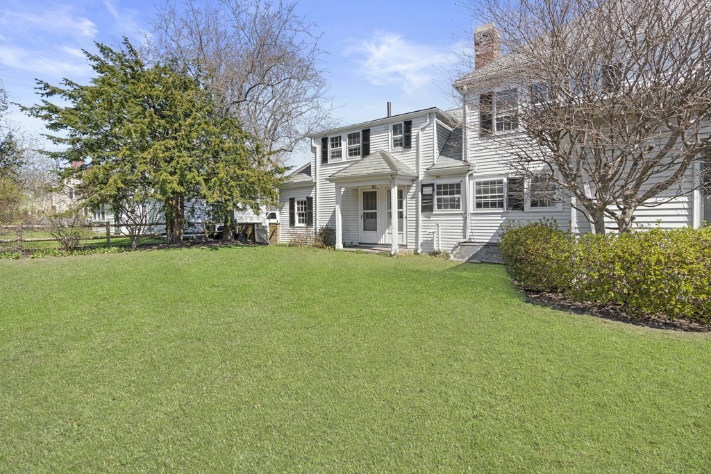 160 Reservoir Road Chestnut Hill, MA 02467 - Photo 29 of 42 a front view of a house with a garden