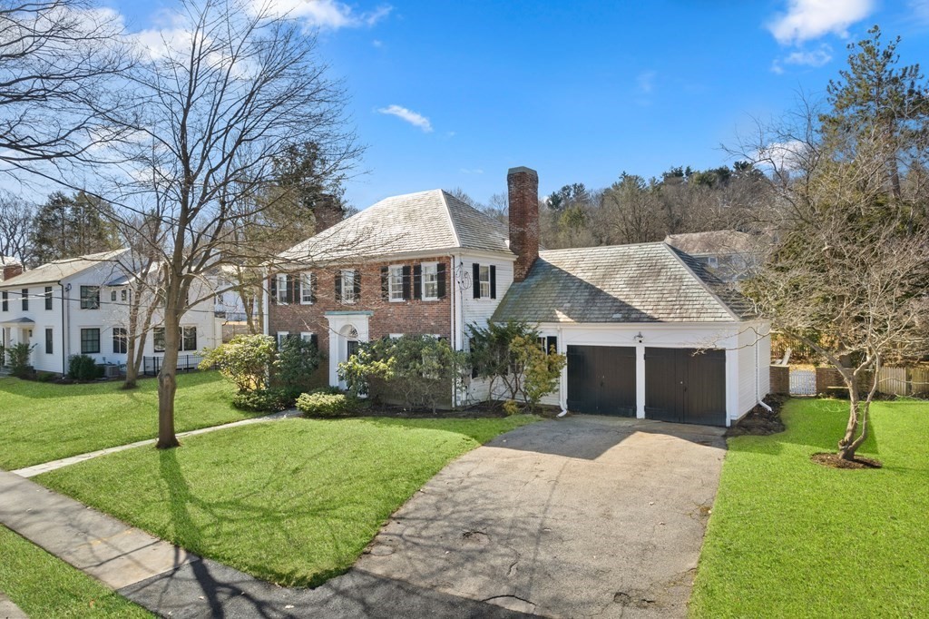 160 Reservoir Road Chestnut Hill, MA 02467 - Photo 31 of 42 a front view of a house with a yard and trees