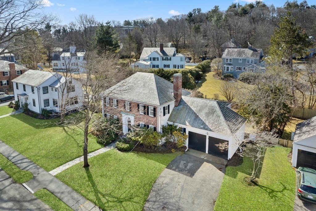 160 Reservoir Road Chestnut Hill, MA 02467 - Photo 32 of 42 a front view of a house with a garden and plants