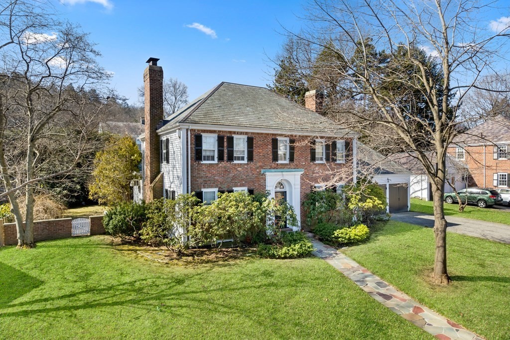 160 Reservoir Road Chestnut Hill, MA 02467 - Photo 34 of 42 a front view of a house with a garden and yard