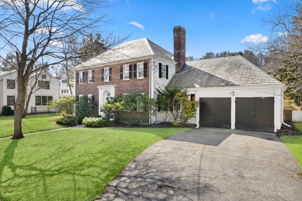 160 Reservoir Road Chestnut Hill, MA 02467 - Photo 36 of 42 a front view of a house with a yard and garage