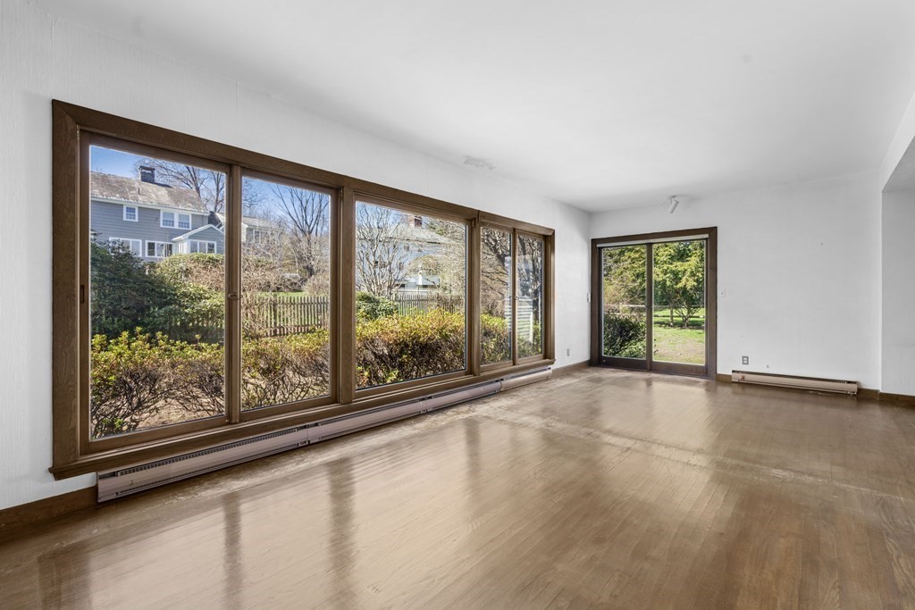 160 Reservoir Road Chestnut Hill, MA 02467 - Photo 4 of 42 wooden floor in an empty room with a window