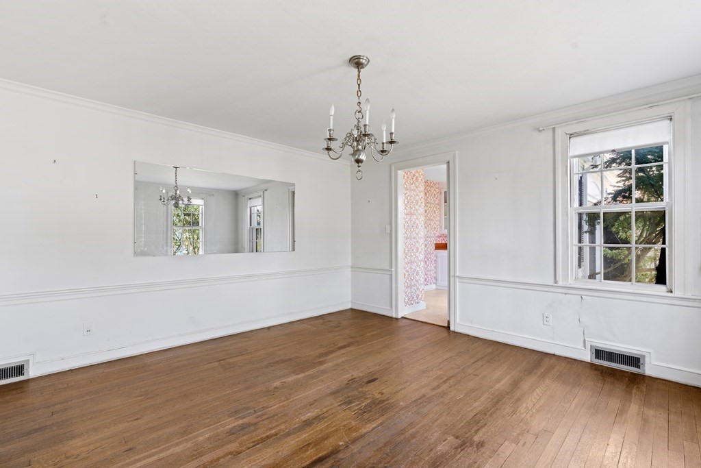 160 Reservoir Road Chestnut Hill, MA 02467 - Photo 10 of 42 wooden floor in an empty room with a window