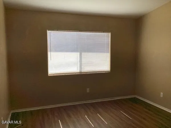 a view of bathroom with a sink and a mirror