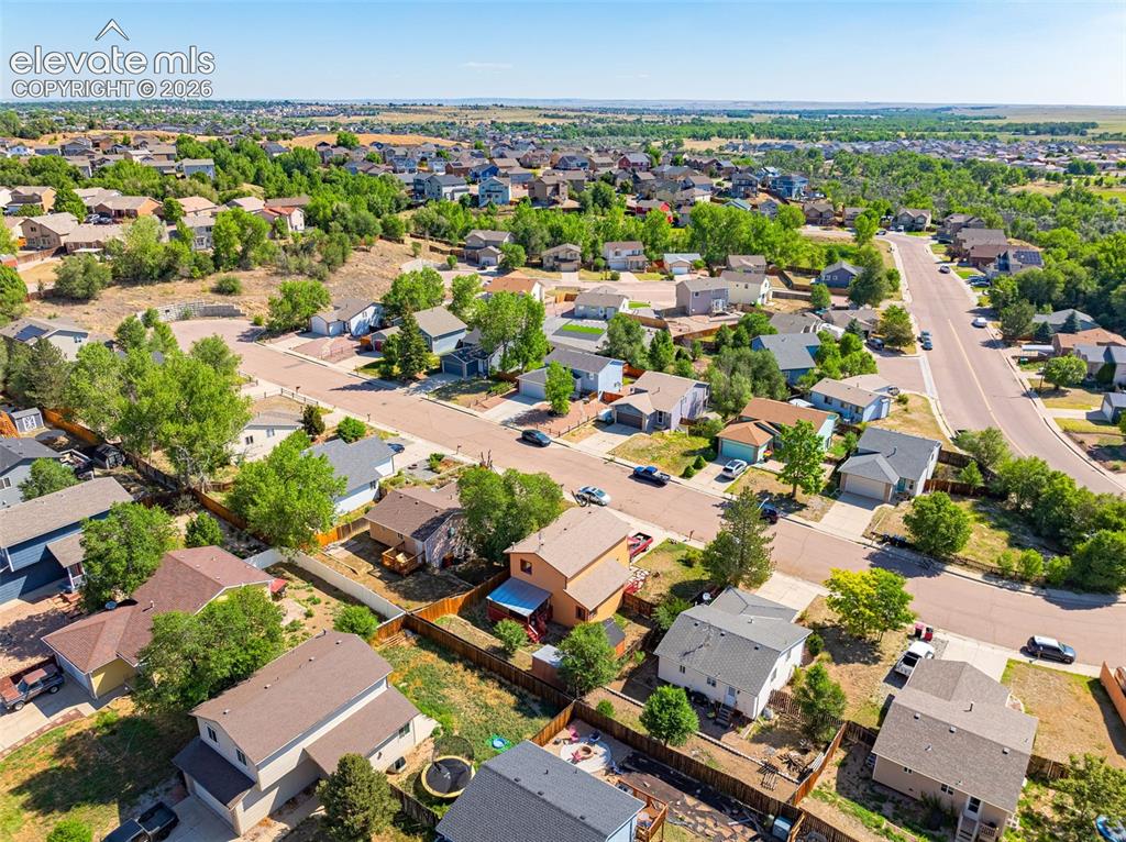 613 Wheat Field Road Fountain, CO 80817 - Photo 28 of 32 an aerial view of residential houses with outdoor space